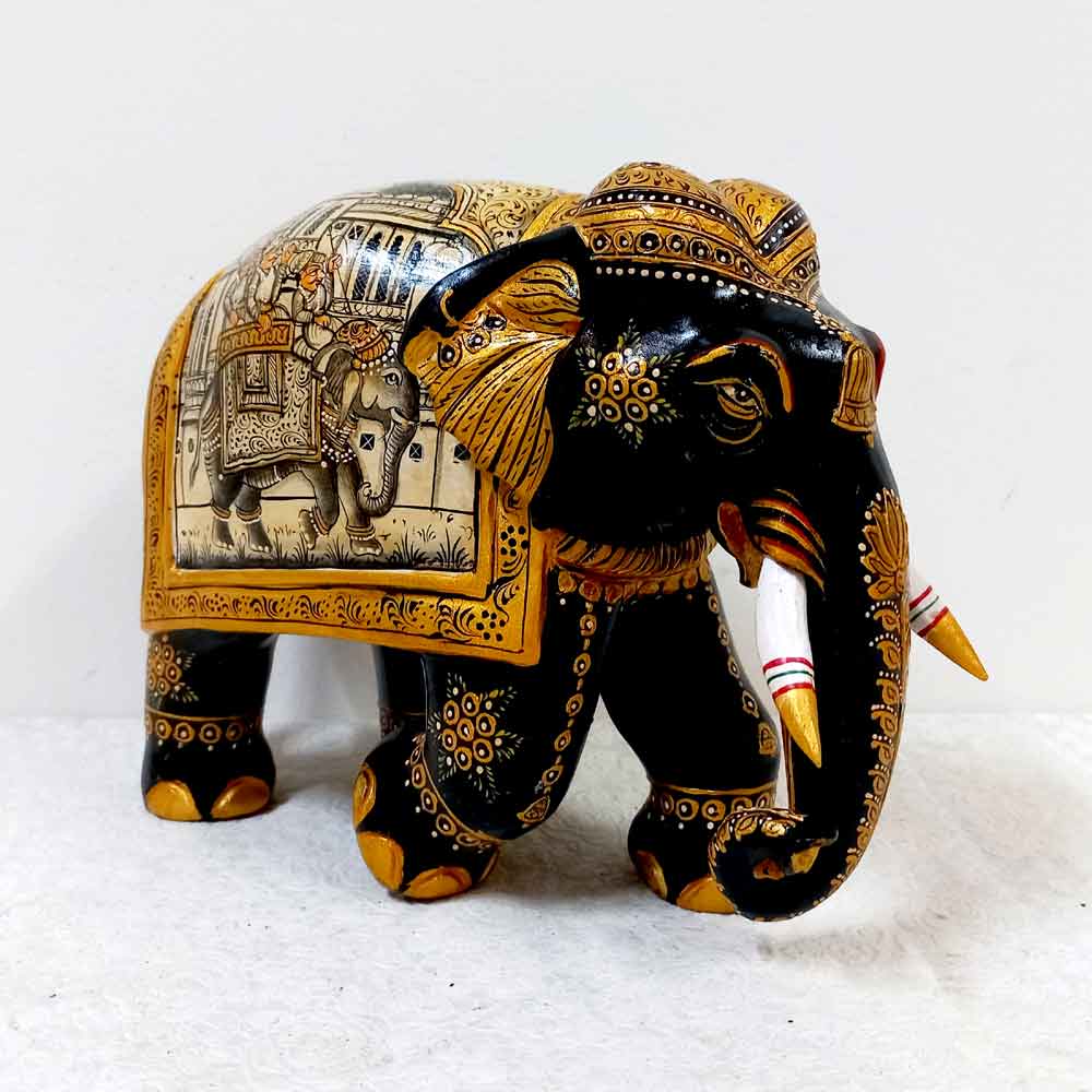 Elegant Kadamba wood elephant figurine adorned with detailed miniature paintings and fine craftsmanship.
