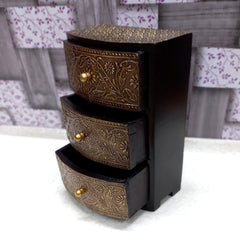 Elegant vintage wooden jewelry drawer box with metal accents and floral antique design, suitable for storing earrings and chains.