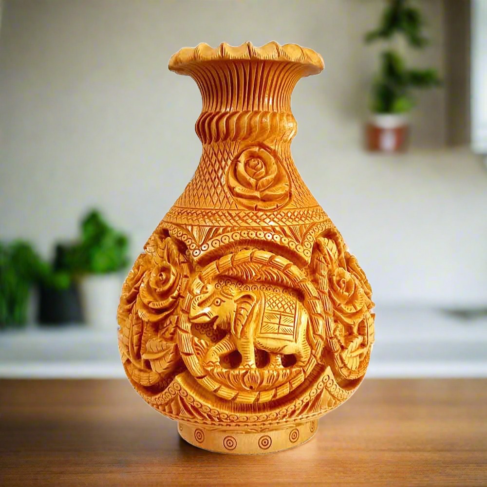 Closeup of exquisite hand workmanship floral elephant designs on vase.