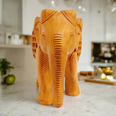 Wooden elephant idol with carved mesh stomach and baby elephant inside, great for home decoration and gifts