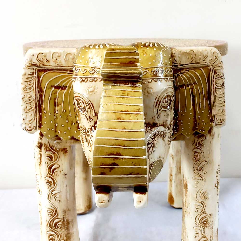 A beautiful wooden elephant that serves as both a functional stool and a decorative showpiece.