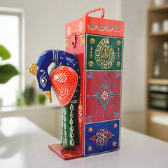 A gorgeous showpiece and bottle holder with a peacock design and beautiful emboss painting.