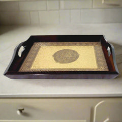 A beautiful wooden tray with an embossed floral design, made to enhance the look of a kitchen or dining table.
