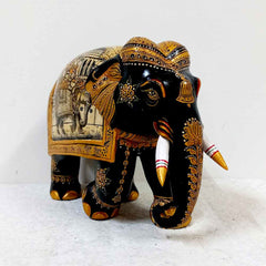 Exquisite hand-painted Kadamba wood elephant with miniature art, a magnificent piece for home or office decoration.