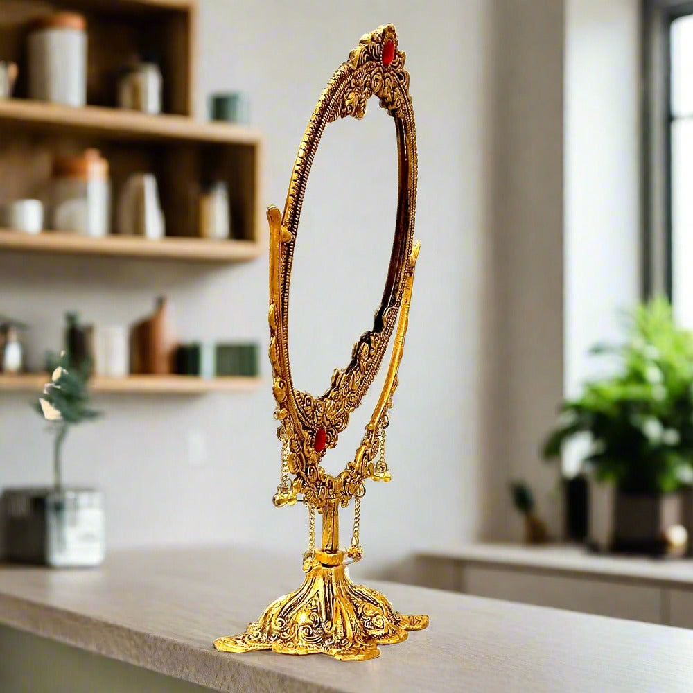 A fine quality metal vanity mirror that can be raised or lowered.