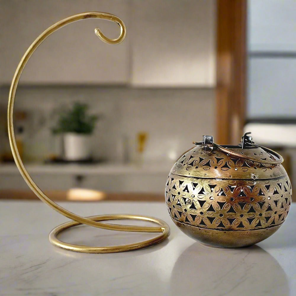 A fine-quality metal mesh candle holder, a stunning showpiece that can be kept on a table.