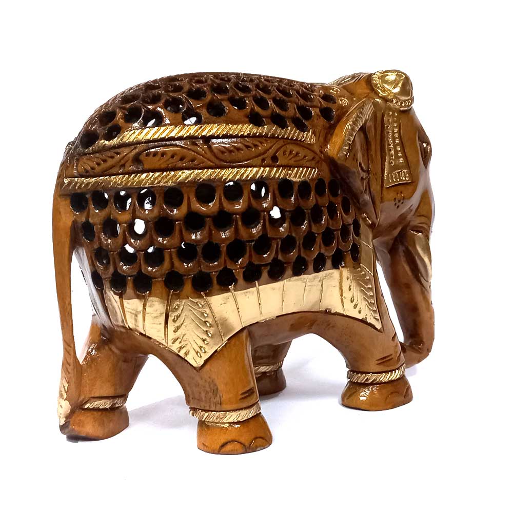 A fine quality wooden elephant statue with beautiful carvings on its forehead, back, and legs.