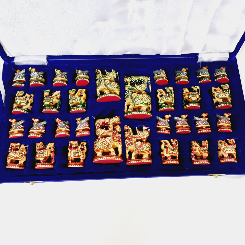 Finely crafted wooden chess set with red and green hand-painted pieces, traditional Indian design and 15-inch board.