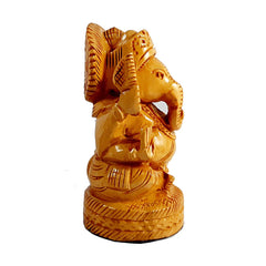Detailed blessing hand pose on traditional Jaipur wooden Ganesh statue.