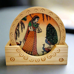 Round wooden tea coaster adorned with intricate handmade gemstone painting, perfect for tea time elegance