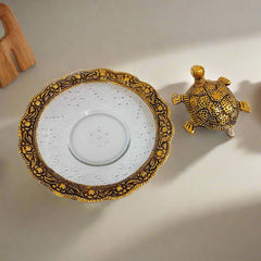 Decorative Vastu tortoise featuring glass bowl and detailed metal carving, ideal for home and office