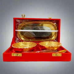 Two-tone polished German silver bowls with tray and spoon in a velvet box.