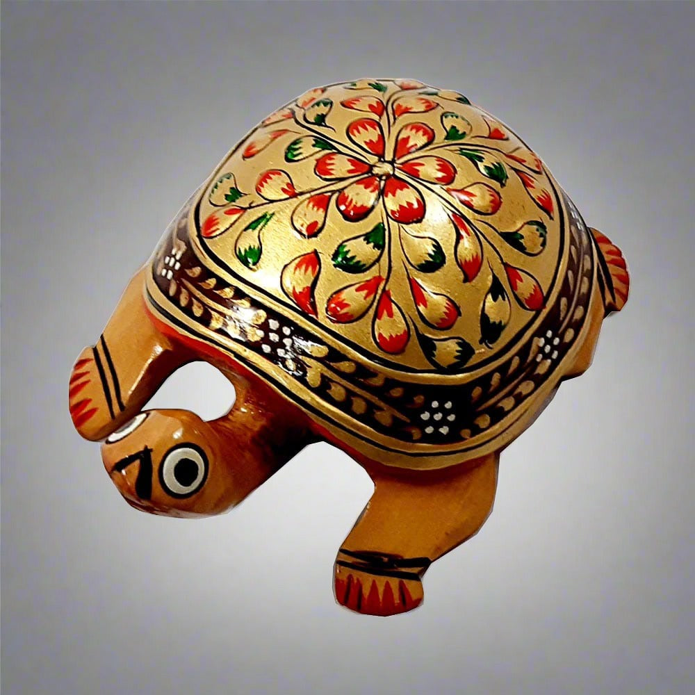 A golden wooden turtle, a wonderful piece for a pooja room, home, or office for worship.