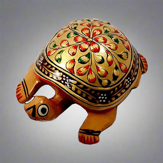 A golden wooden turtle, a wonderful piece for a pooja room, home, or office for worship.