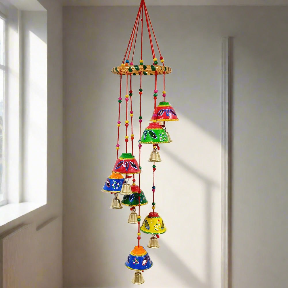 A gorgeous handmade toran with round papermache bells and a beautiful design.