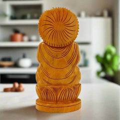 A hand-carved wooden Buddha figurine, a beautiful piece for an office desk.
