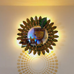 A beautiful hand-painted Krishna wall decor showpiece with a leaf design and fitted with LED lights.