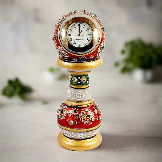 A gorgeous hand-painted marble showpiece clock, studded with kundan, that will enhance the look of any room.