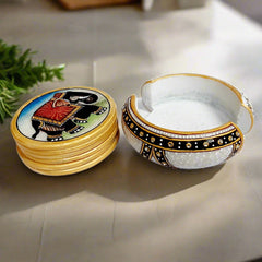 Hand-painted marble coasters featuring vibrant elephant artwork and decorative kundan on the holder