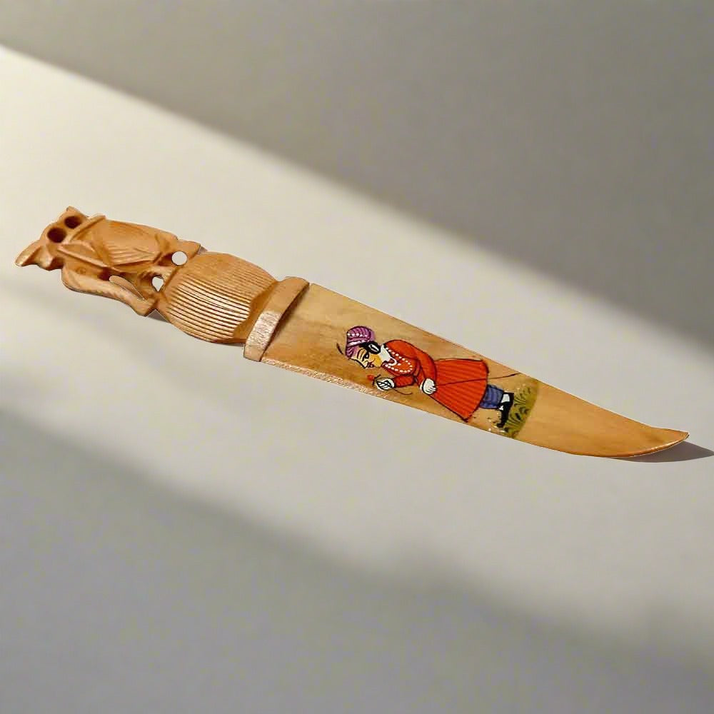 A hand-painted wooden paper cutting knife with good carving and a smooth polish.