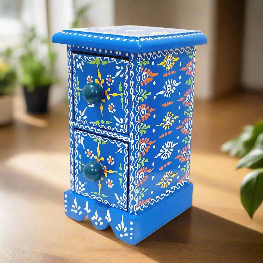 A beautiful hand-painted wooden jewelry box with two drawers for storing small jewelry.