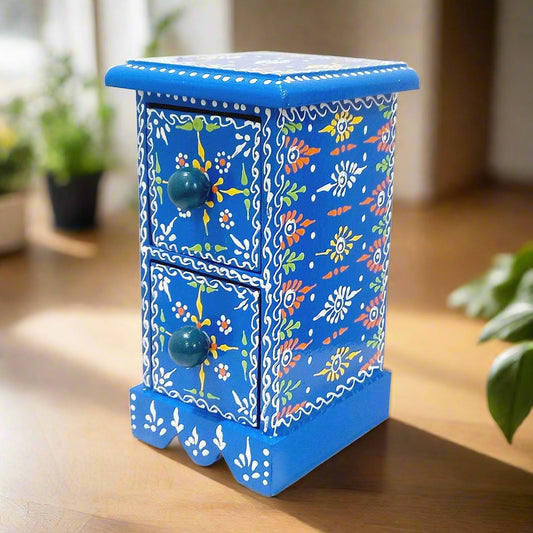 A beautiful hand-painted wooden jewelry box with two drawers for storing small jewelry.