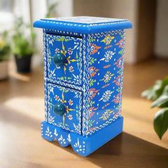 A beautiful hand-painted wooden jewelry box with two drawers for storing small jewelry.
