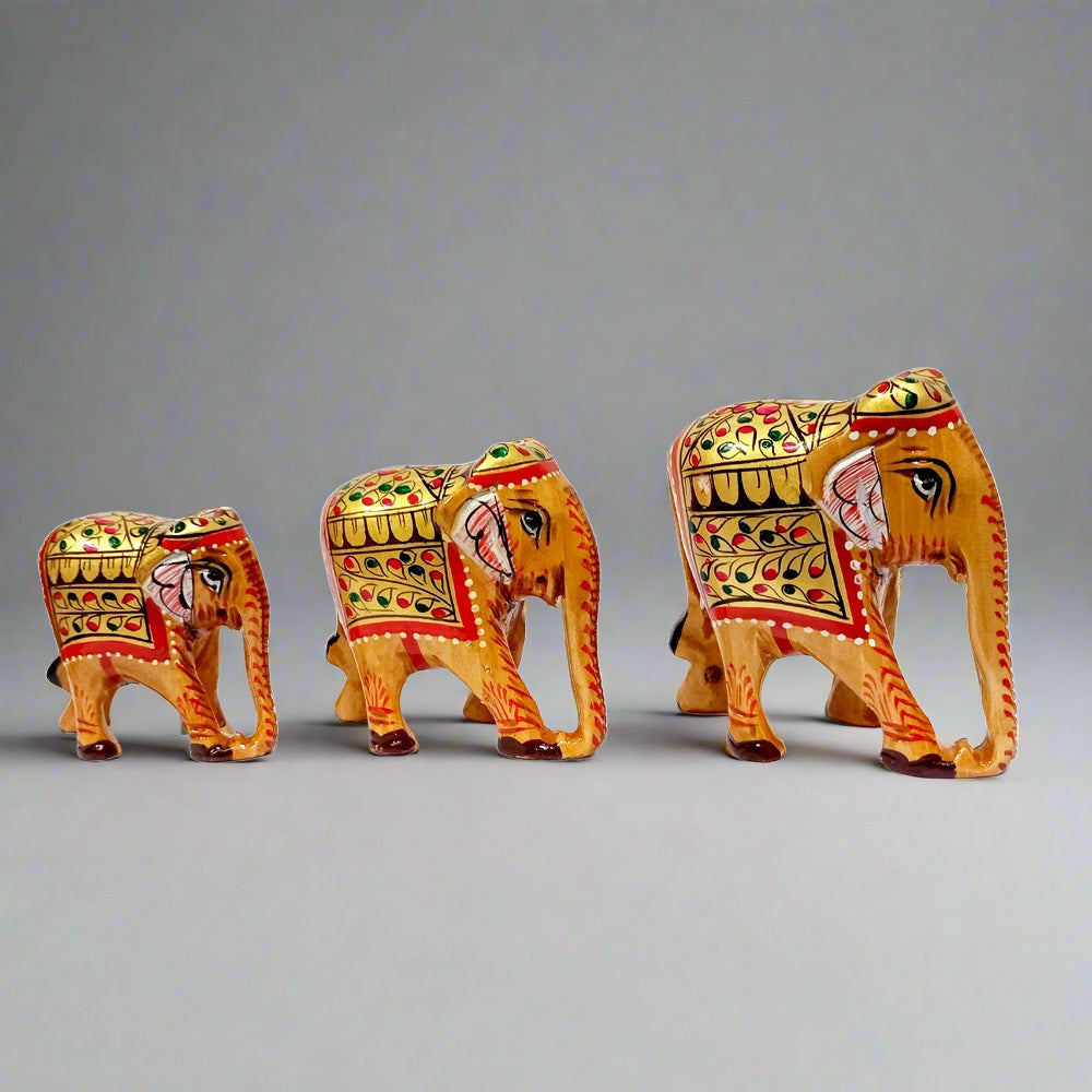 Hand-painted wooden elephant family set, traditional Indian handicraft.