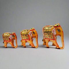 Hand-painted wooden elephant family set, traditional Indian handicraft.