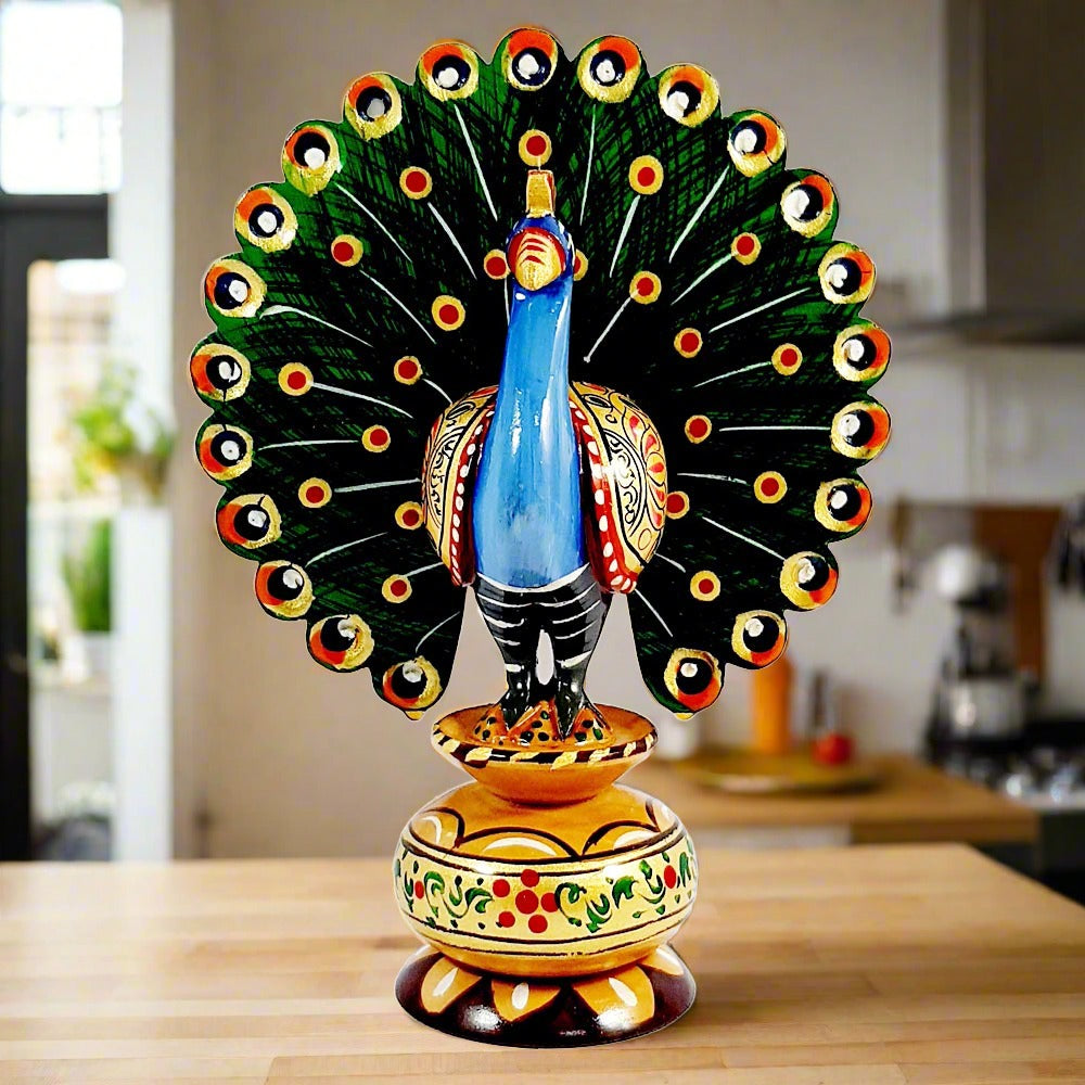 Detailed hand-painted wooden peacock statue capturing the elegance and grace of dance
