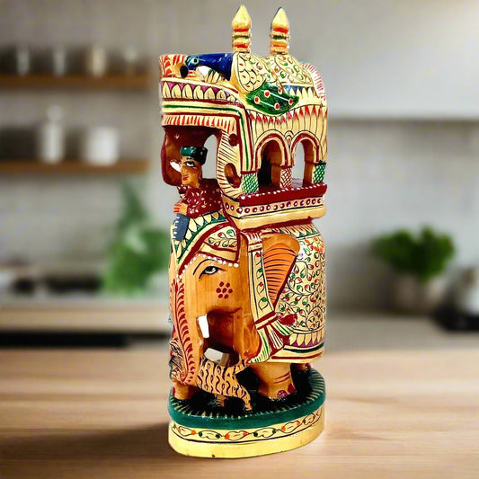 A handcrafted wooden Ambadi elephant statue with a king and a mahout.