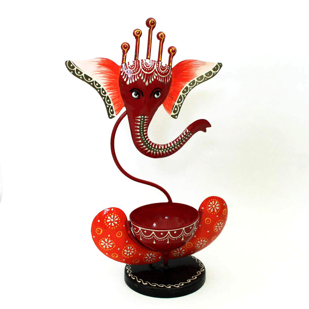 Handcrafted metal Ganesh candle holder for puja room and festive decoration.