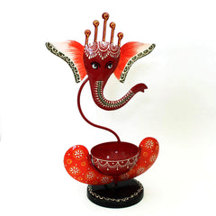 Handcrafted metal Ganesh candle holder for puja room and festive decoration.