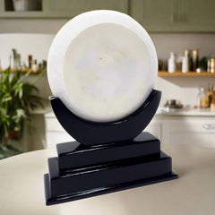 A handcrafted Rajasthani lady painting on a marble plate, presented on a nice wooden stand.