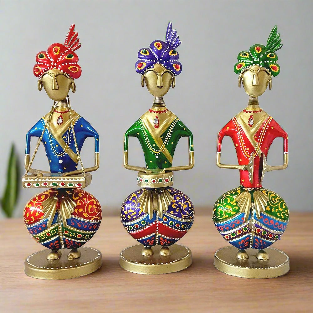 A handcrafted set of 3 Rajasthani musicians, a metal showpiece with beautiful hand painting.