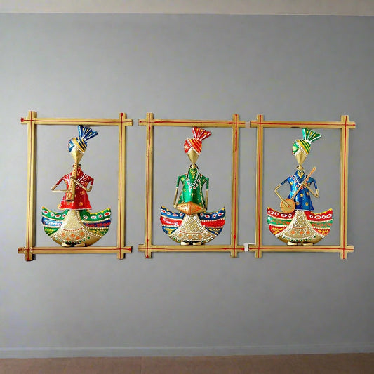 A handcrafted 3-piece metal wall art set of Rajasthani musicians playing instruments.