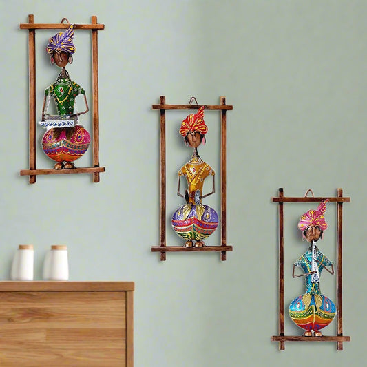 A handcrafted 3-piece set of Rajasthani musician wall frames made of metal.