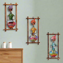 A handcrafted 3-piece set of Rajasthani musician wall frames made of metal.