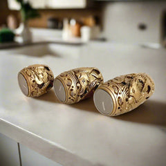 A handcrafted wood carving t-light holder trio, perfect for creating a cozy atmosphere.