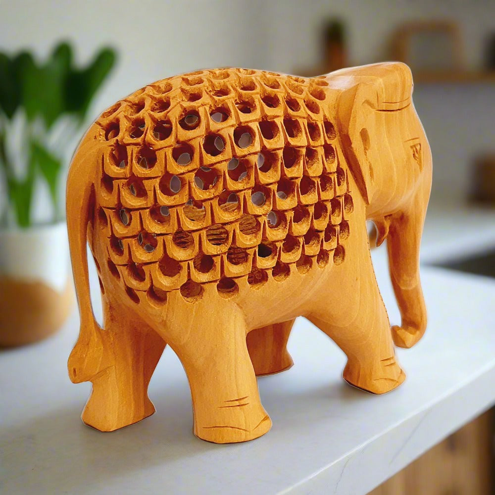 Handcrafted wood elephant showpiece featuring fine mesh design and baby elephant detail, perfect for gifting