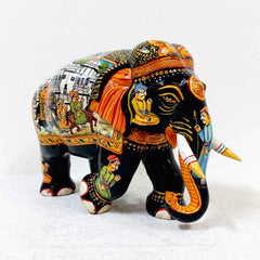 Handcrafted wooden elephant featuring Mughal miniature paintings, showcasing rich detail and artistic heritage.