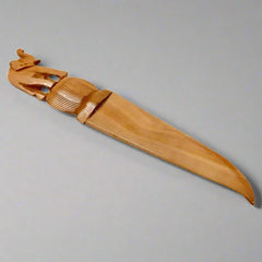 Handcrafted wooden paper cutter with a detailed elephant design carved on the handle for office use.