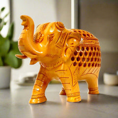 A handcrafted wooden forged elephant, a beautiful piece for home decor and gifting.