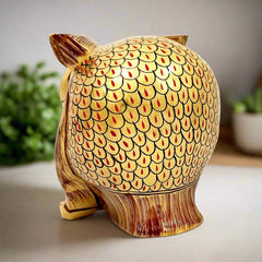 A handcrafted wooden owl figurine, a great gift for good luck and Feng Shui.