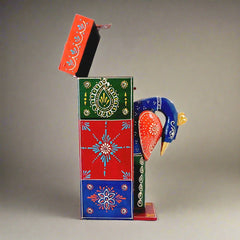 A handcrafted wooden peacock bottle holder with stunning multi-colored emboss painting.