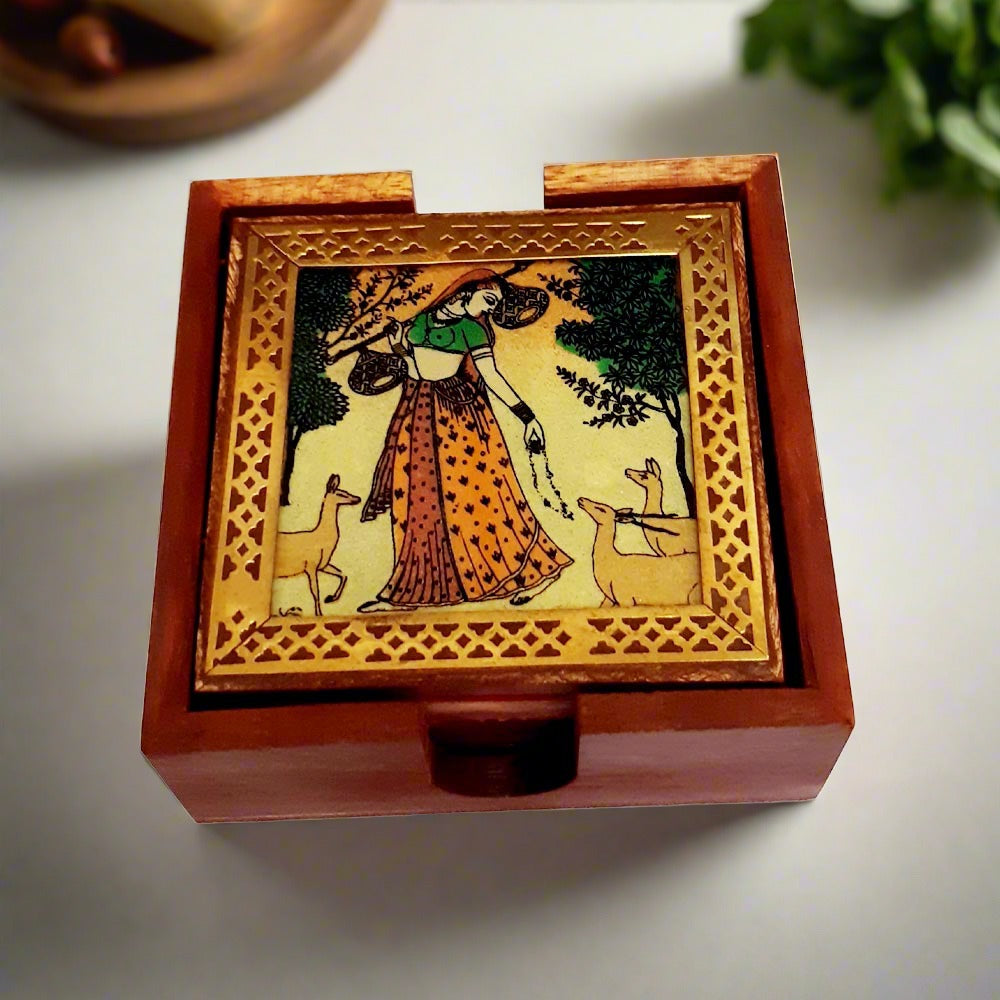A handmade gemstone coaster set with brass work on each coaster and a matching holder.