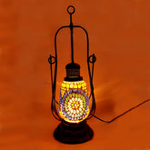 Handmade lantern-shaped lamp made of glass, metal, and wood with intricate mosaic work and crystal decorations.