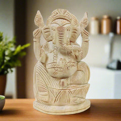 A beautiful handmade Ganesh statue crafted from Saven wood, bringing happiness and peace to your home and office.