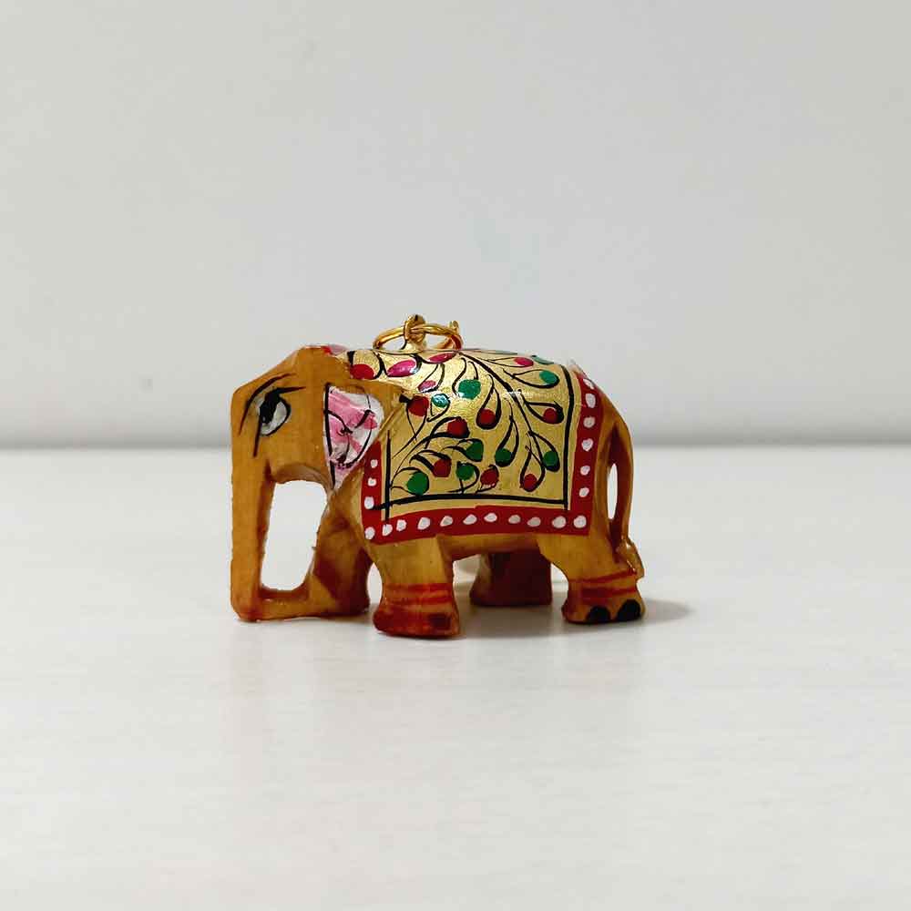 A beautiful handmade wooden elephant key chain that will keep your keys safe.
