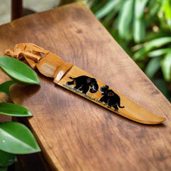 A handmade wooden paper cutter, a good example of traditional Rajasthani art.